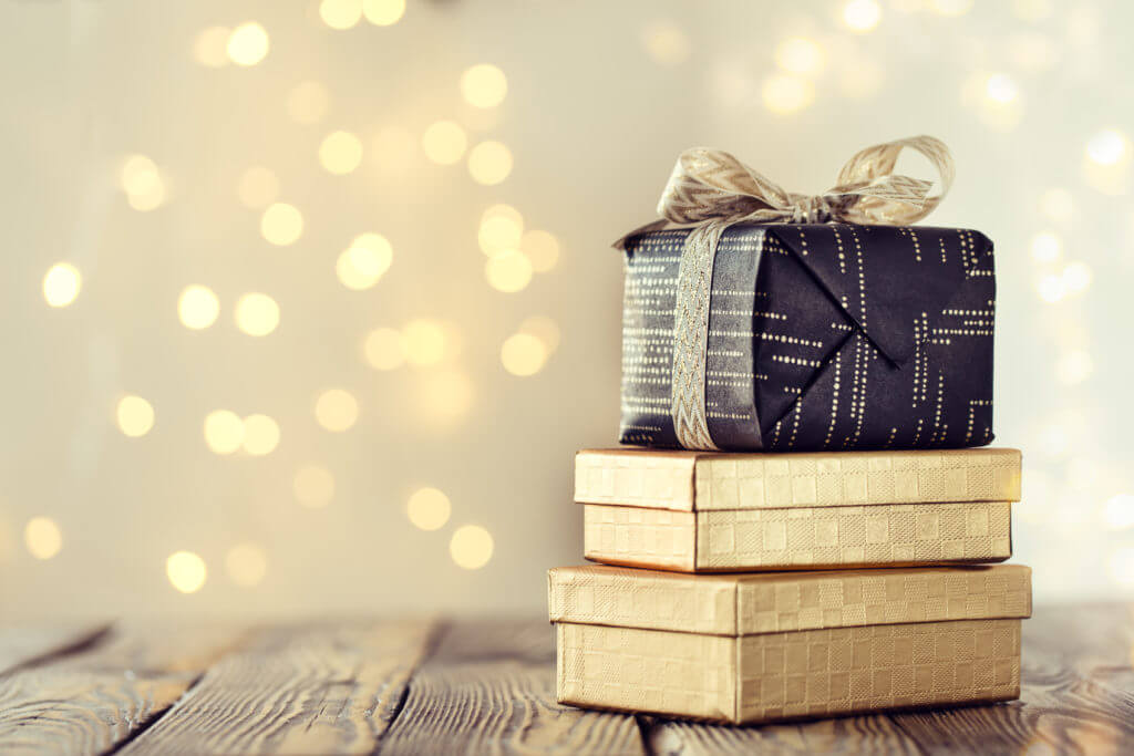 Composed stack of wrapped and decorated boxes with Christmas pre